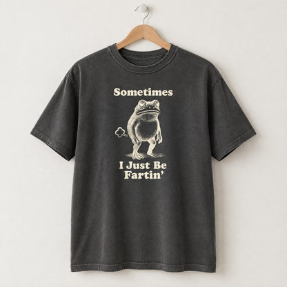 Pepper gray Comfort Colors shirt on a hanger with Sometimes I Just Be Fartin frog design