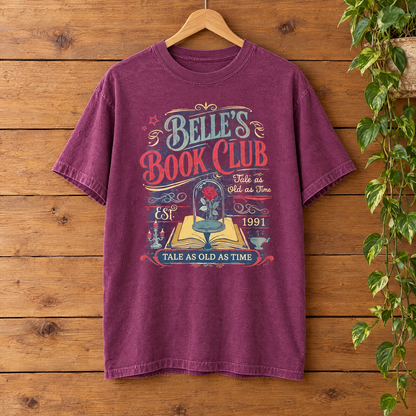 Belle's Book Club Comfort Colors shirt in Berry on a wooden hanger