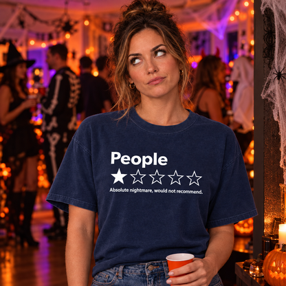 Woman wearing navy Comfort Colors People One Star Review funny introvert shirt at a Halloween party
