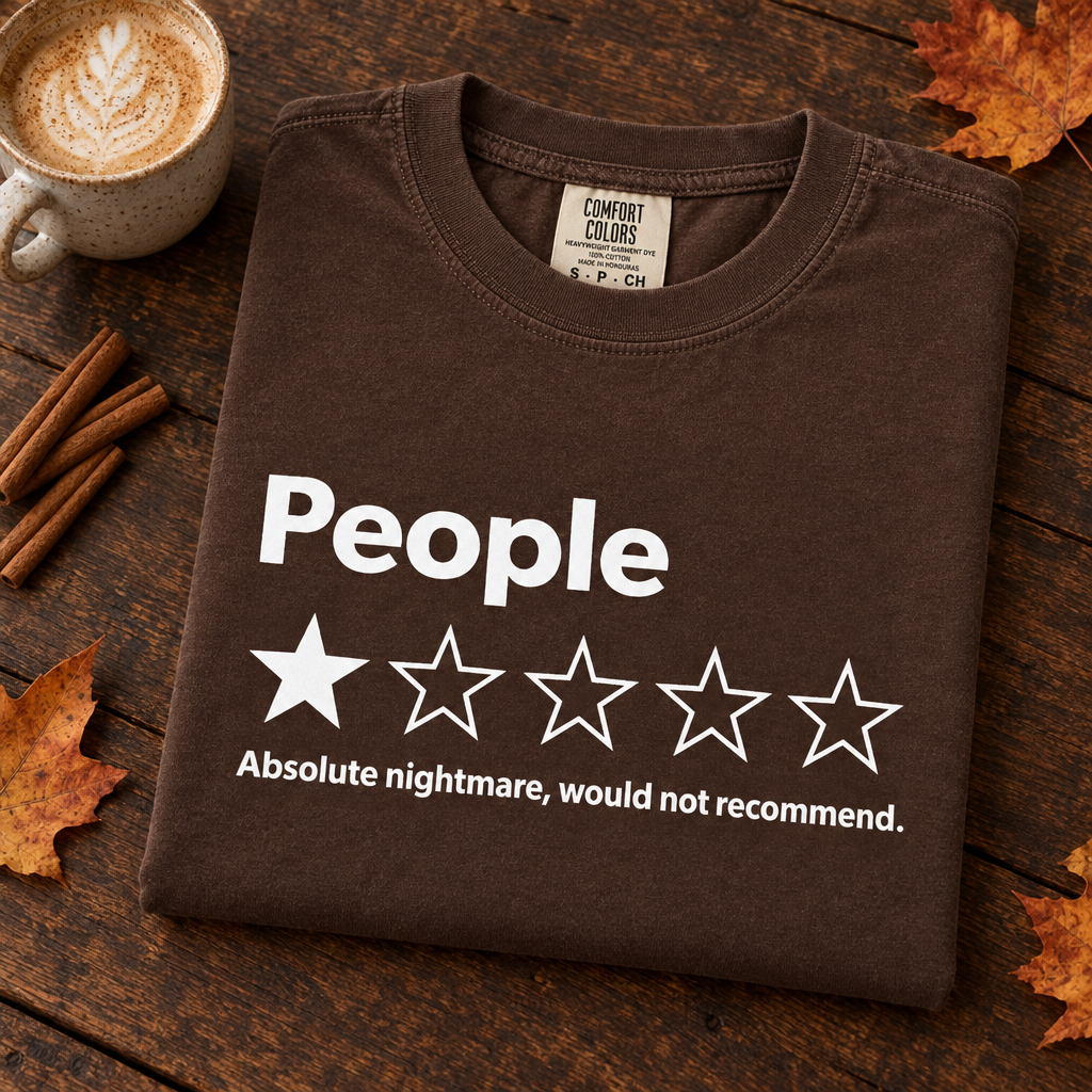 People One Star Review Comfort Colors shirt in Espresso, folded with fall latte
