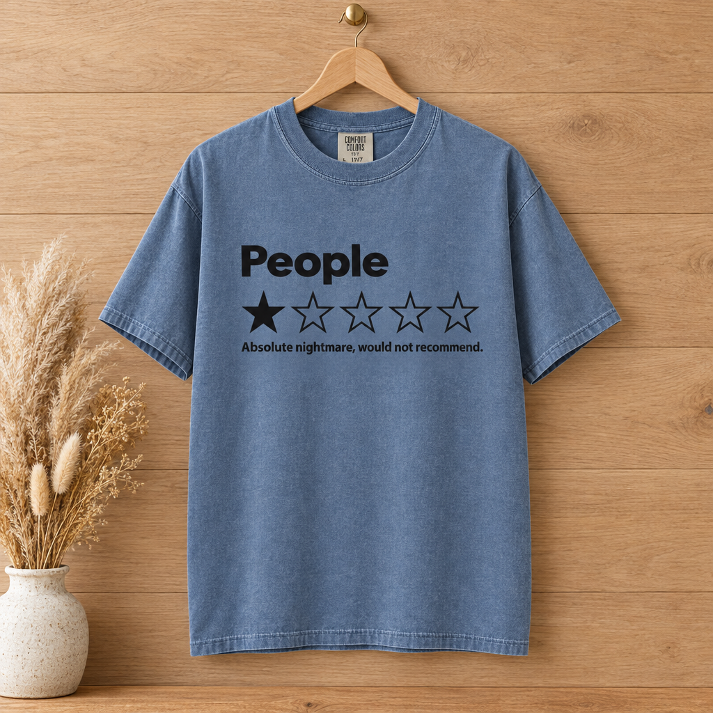 People One Star Review Comfort Colors shirt in Blue Jean on a wooden hanger