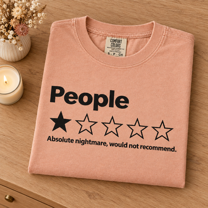 People one star review funny graphic tee in Peachy, neatly folded