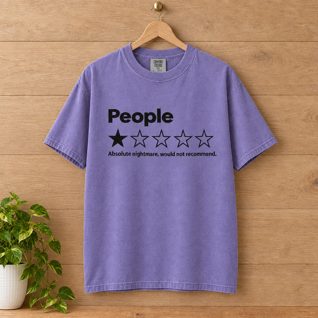People One Star Review Comfort Colors shirt in Violet on a wooden hanger