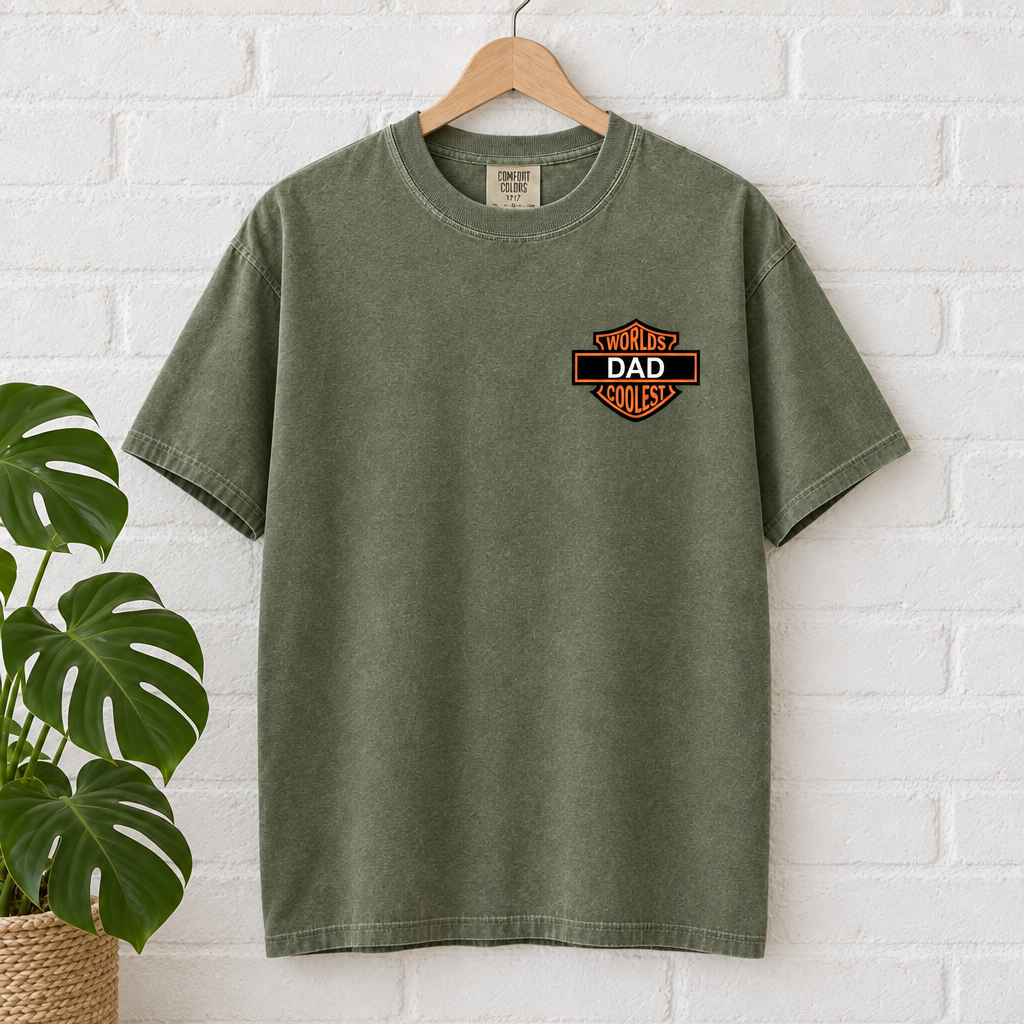 Worlds Coolest Dad custom Comfort Colors shirt in Moss on a hanger