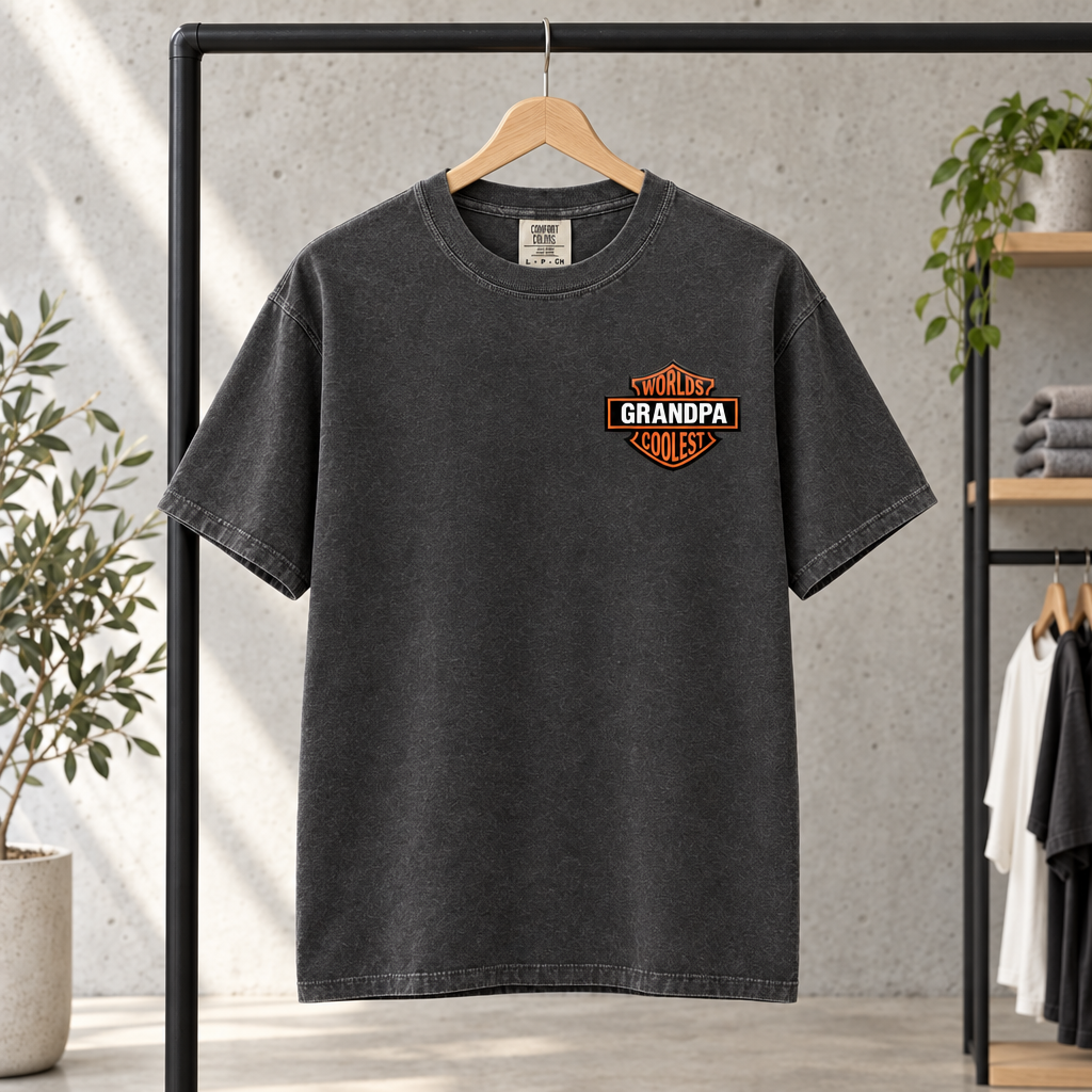 Worlds Coolest Grandpa personalized Comfort Colors shirt in Pepper on a clothing rack