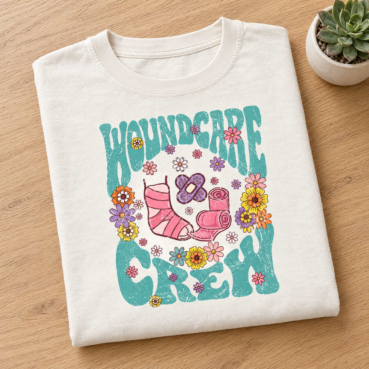 Wound Care Crew Comfort Colors tee in Ivory, neatly folded