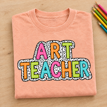 Art Teacher Comfort Colors tee in Peachy, neatly folded