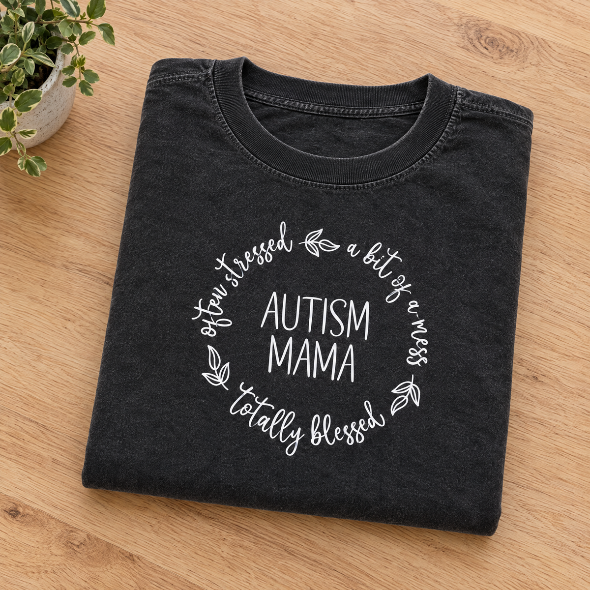 Autism Mama Comfort Colors tee in Black, neatly folded