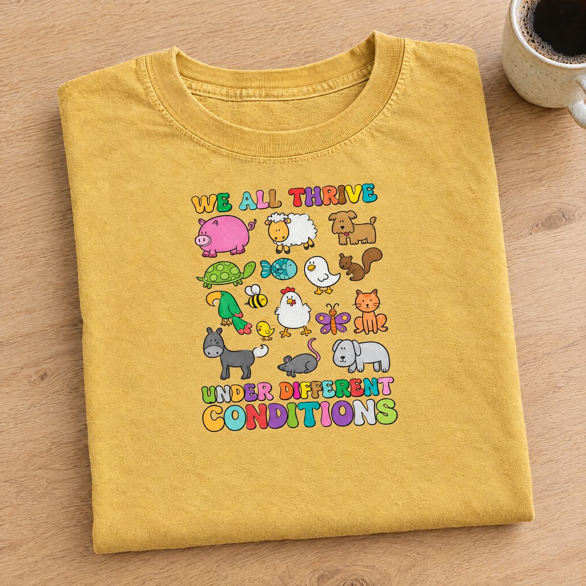 We All Thrive Under Different Conditions Comfort Colors tee in Mustard, neatly folded