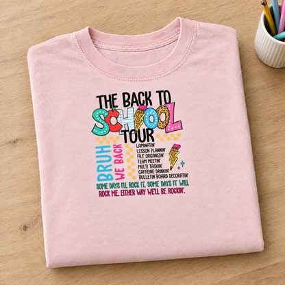 Back to School Tour Comfort Colors tee in Blossom pink, neatly folded