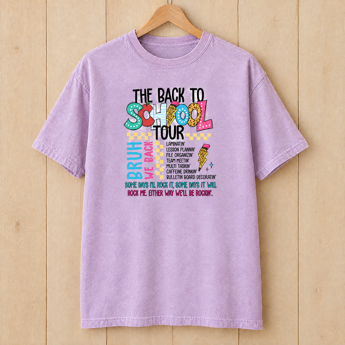 Back to School Tour Comfort Colors shirt in Orchid on a wooden hanger