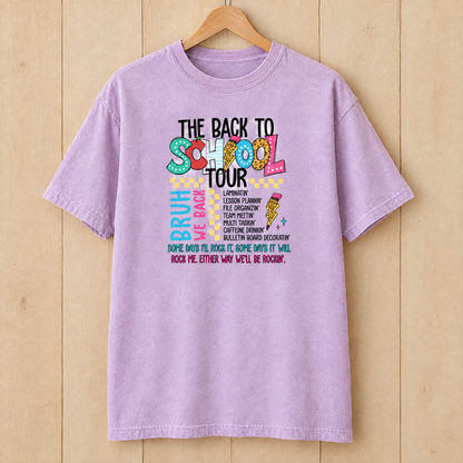 Back to School Tour Comfort Colors shirt in Orchid on a wooden hanger
