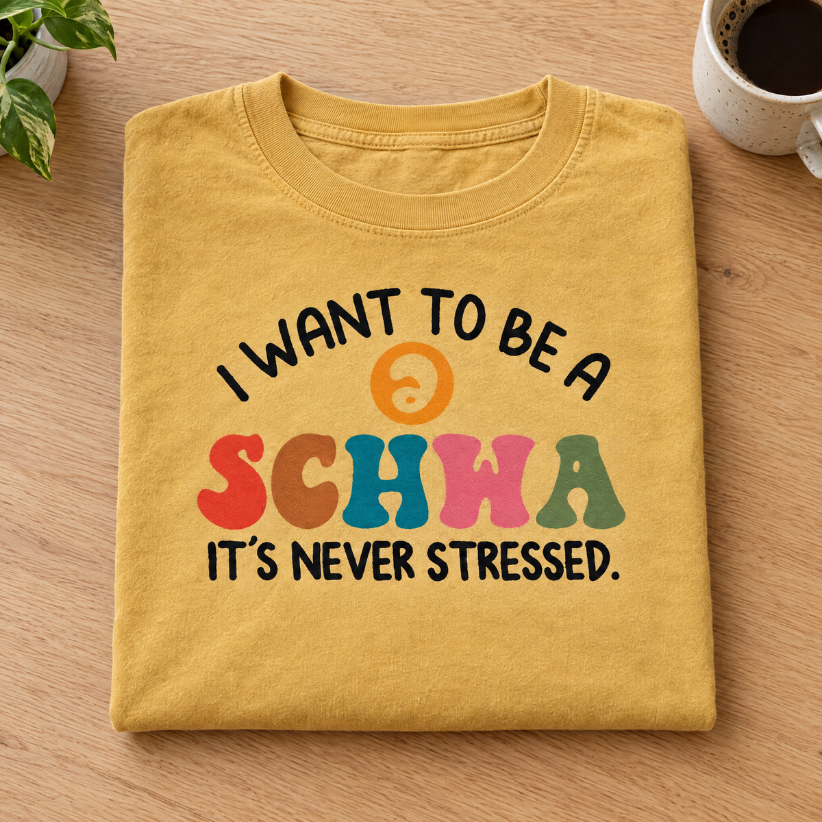 I Want To Be A Schwa shirt in Mustard Comfort Colors, neatly folded