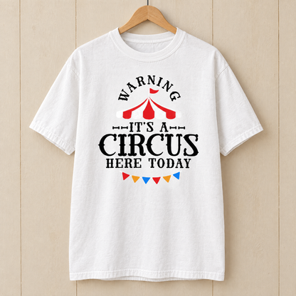 Warning It's A Circus Here Today shirt in White Comfort Colors, on a wooden hanger