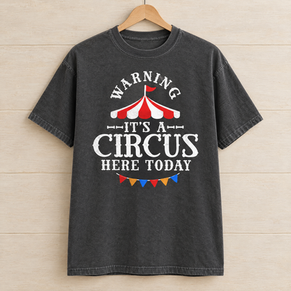 Warning It's A Circus Here Today shirt in Pepper Comfort Colors, on a wooden hanger