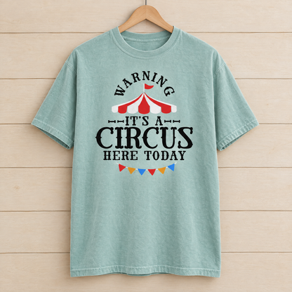 Warning It's A Circus Here Today shirt in Seafoam Comfort Colors, on a wooden hanger