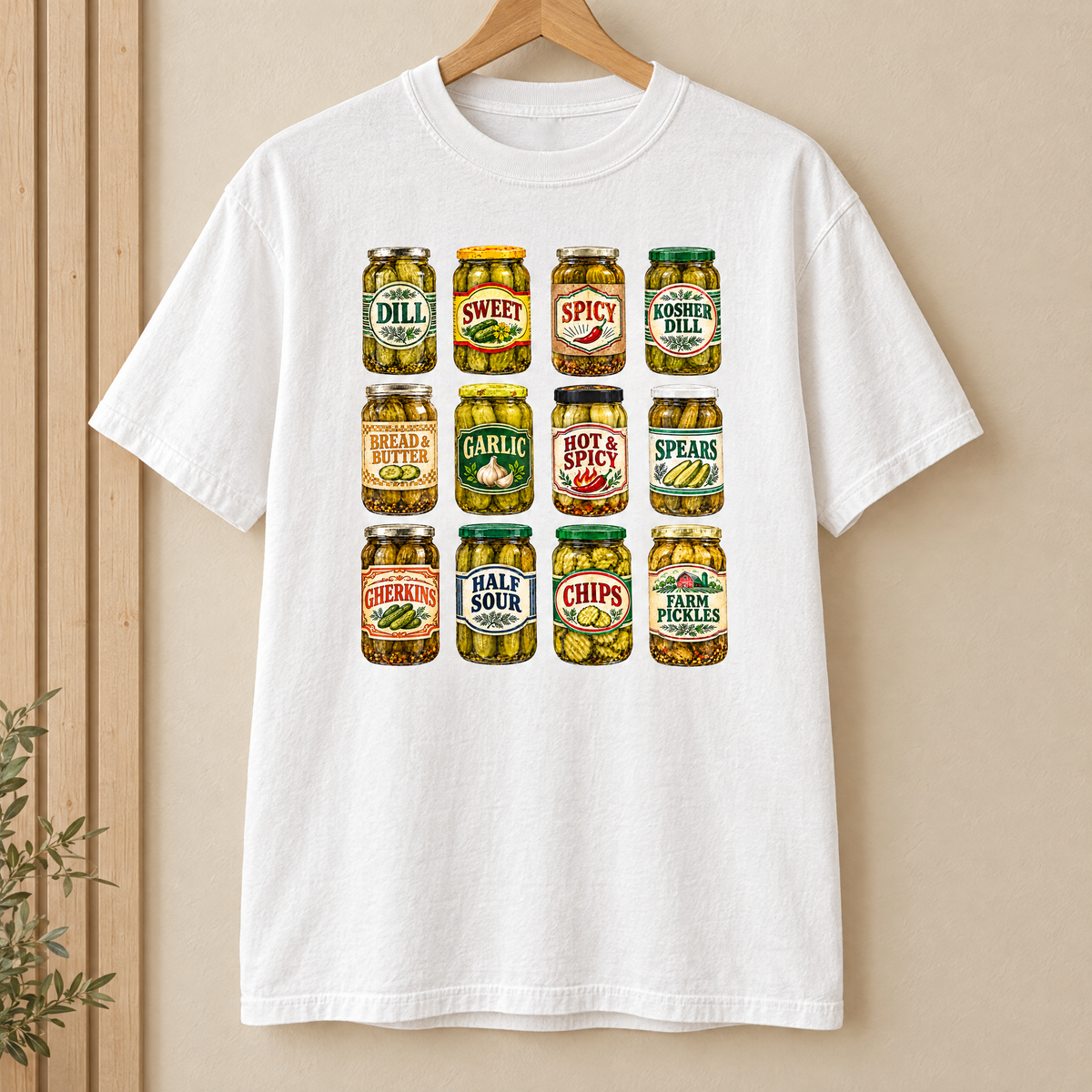 Pickle jar shirt in White Comfort Colors, on a wooden hanger