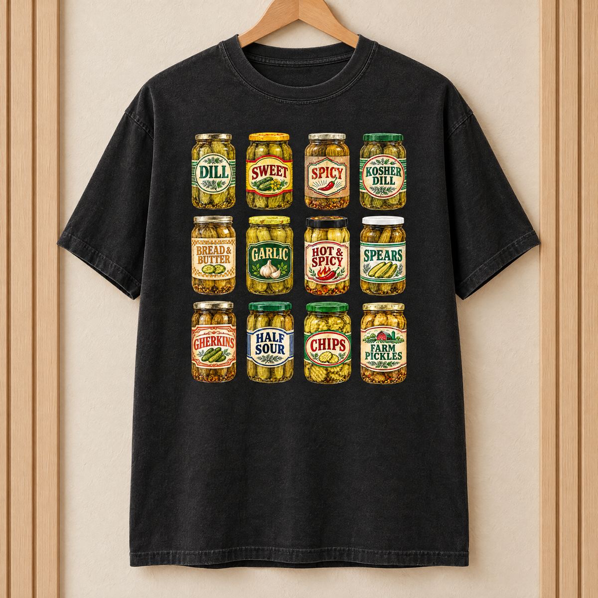 Pickle jar shirt in Black Comfort Colors, on a wooden hanger