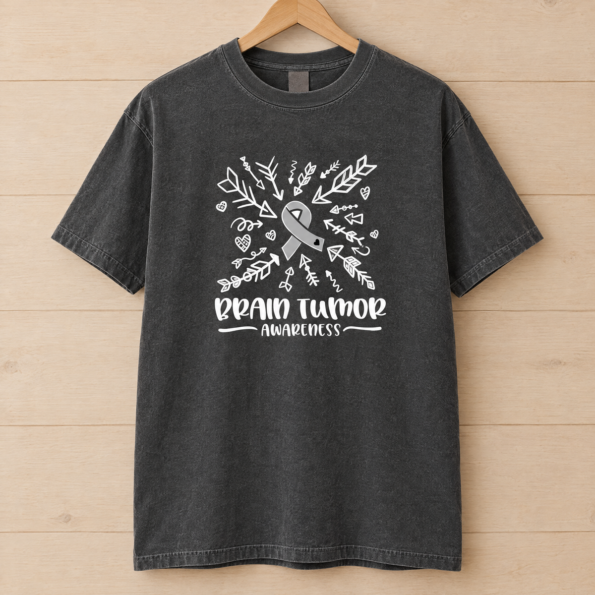 Brain Tumor Awareness shirt in Pepper Comfort Colors, on a wooden hanger