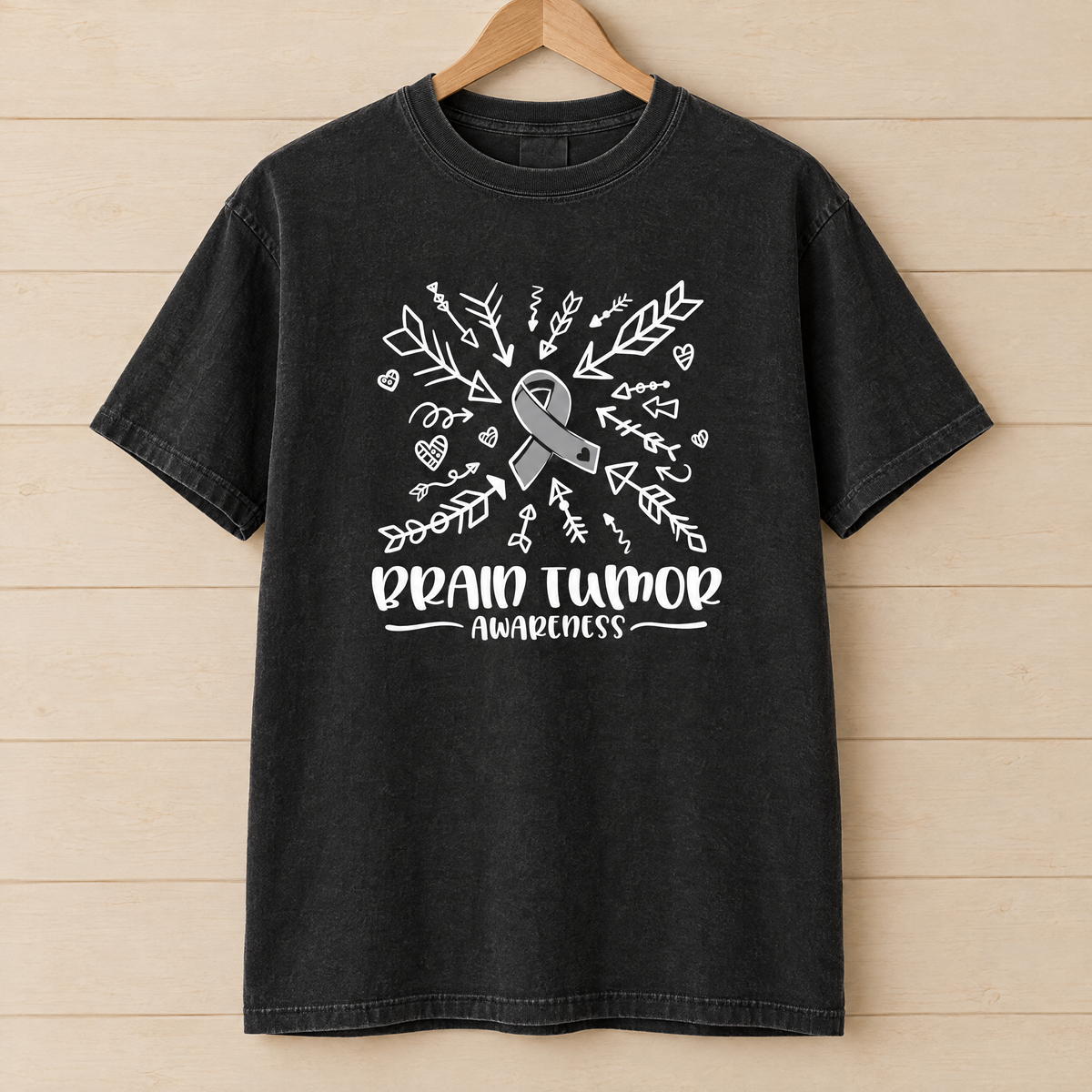 Brain Tumor Awareness shirt in Black Comfort Colors, on a wooden hanger