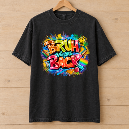 Bruh We Are Back shirt in Black Comfort Colors, on a wooden hanger