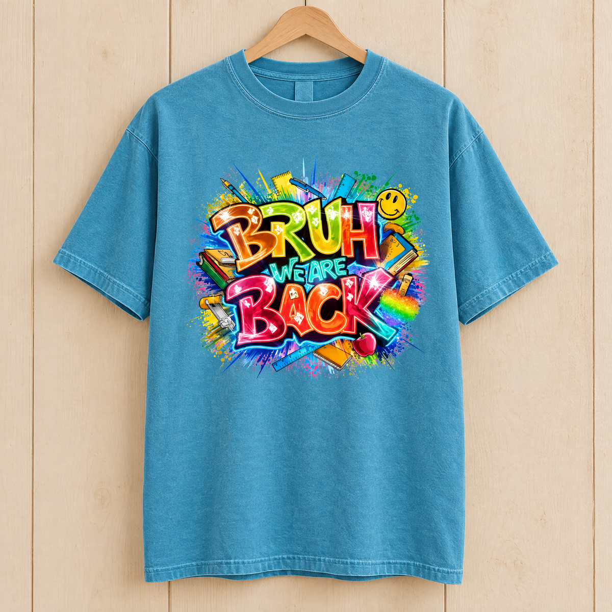 Bruh We Are Back shirt in Lagoon Blue Comfort Colors, on a wooden hanger