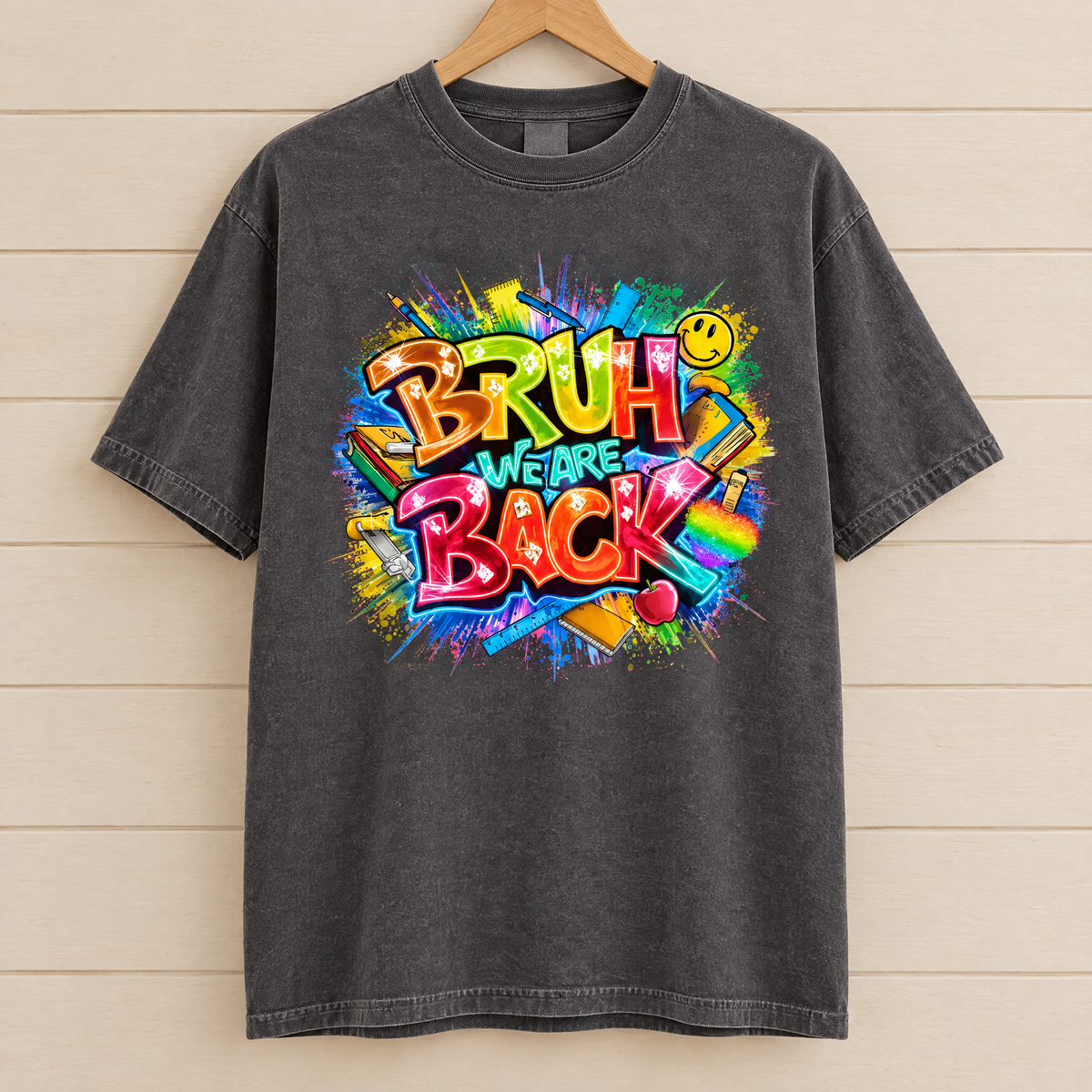 Bruh We Are Back shirt in Pepper Comfort Colors, on a wooden hanger