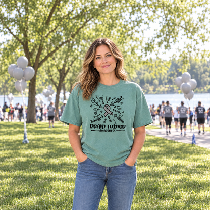 Brain Tumor Awareness shirt in green Comfort Colors, worn by a woman at an awareness walk