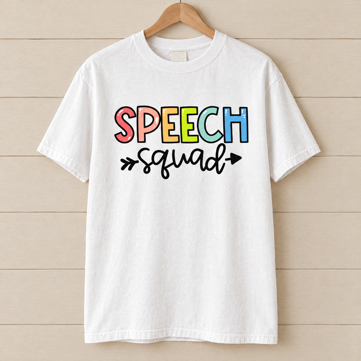 Speech Squad shirt in White Comfort Colors, on a wooden hanger