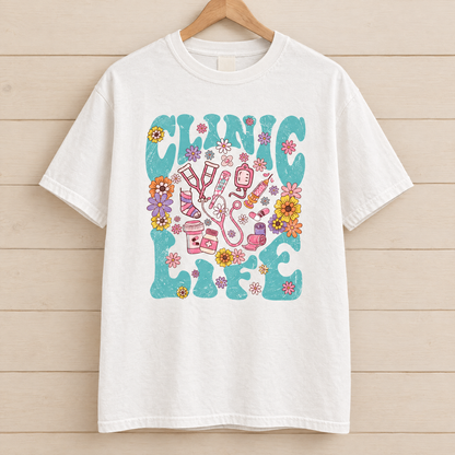 Clinic Life shirt in White Comfort Colors, on a wooden hanger