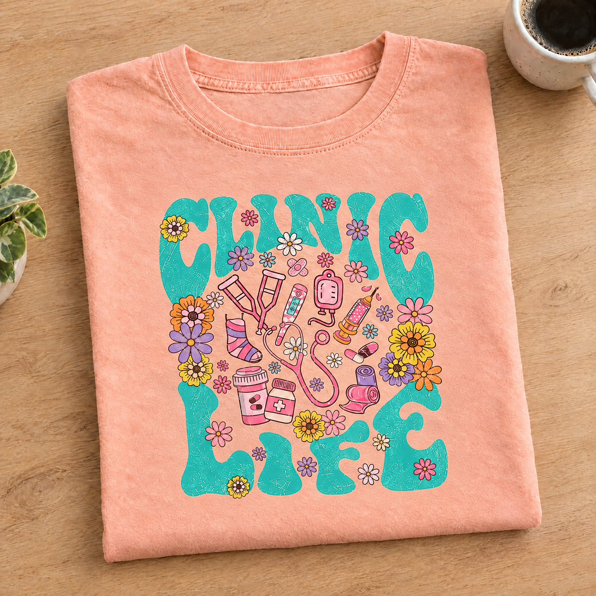 Clinic Life shirt in Peachy Comfort Colors, neatly folded