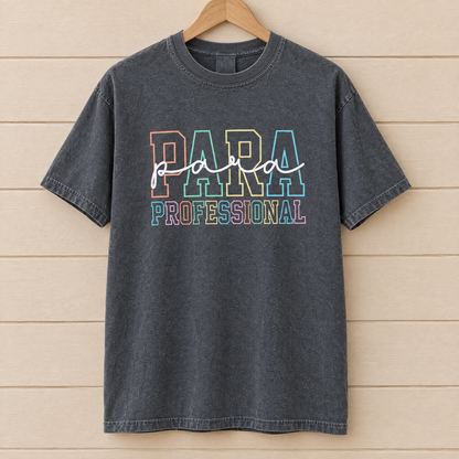 Paraprofessional shirt in Pepper Comfort Colors, on a wooden hanger