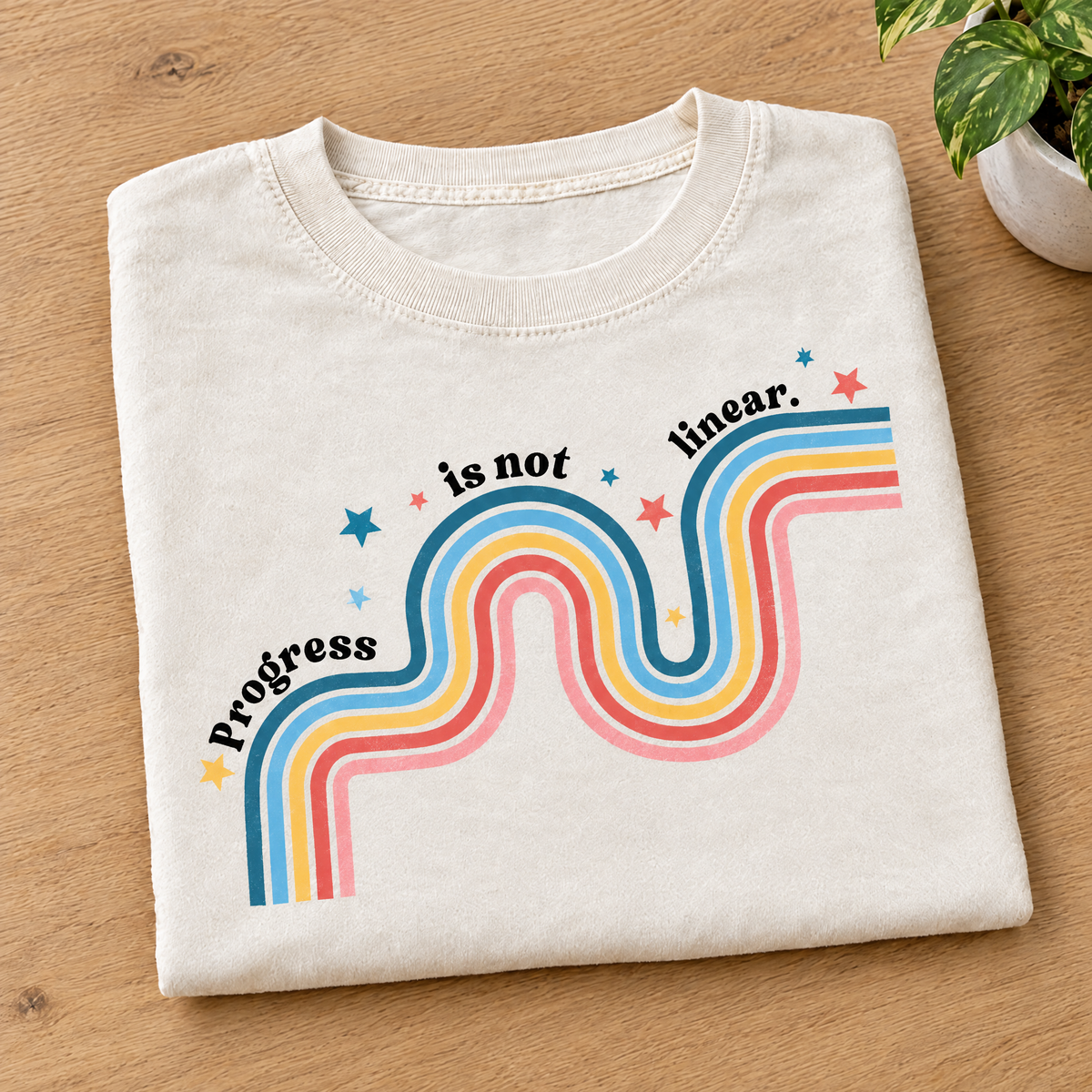 Progress Is Not Linear shirt in Ivory Comfort Colors, neatly folded