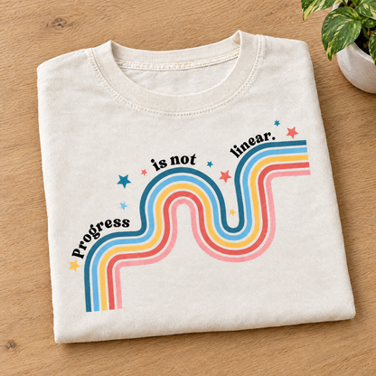 Progress Is Not Linear shirt in Ivory Comfort Colors, neatly folded