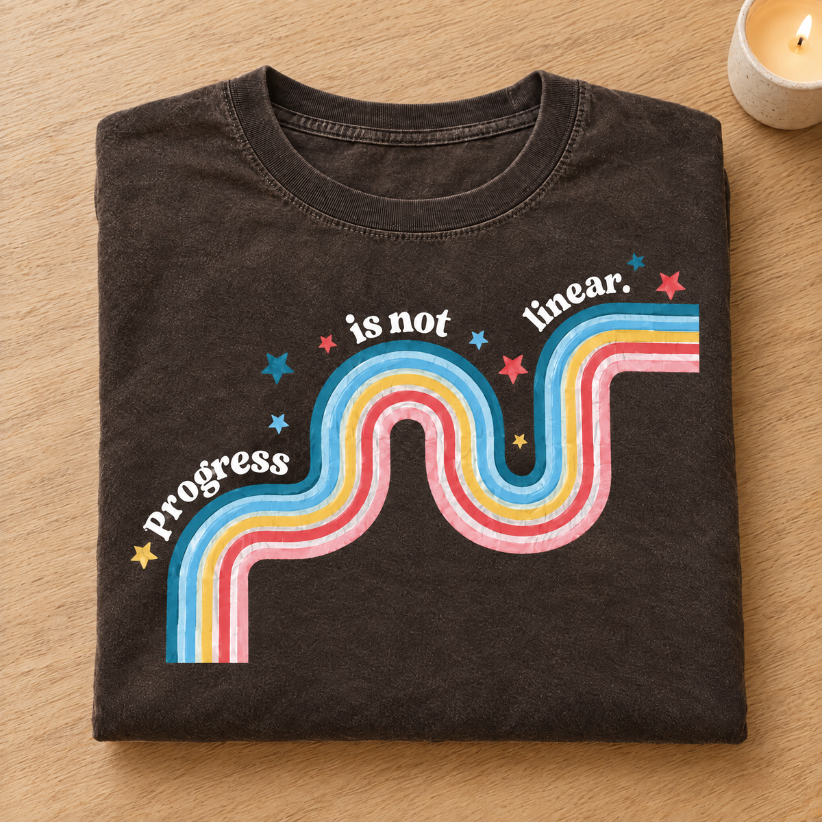 Progress Is Not Linear shirt in Espresso Comfort Colors, neatly folded