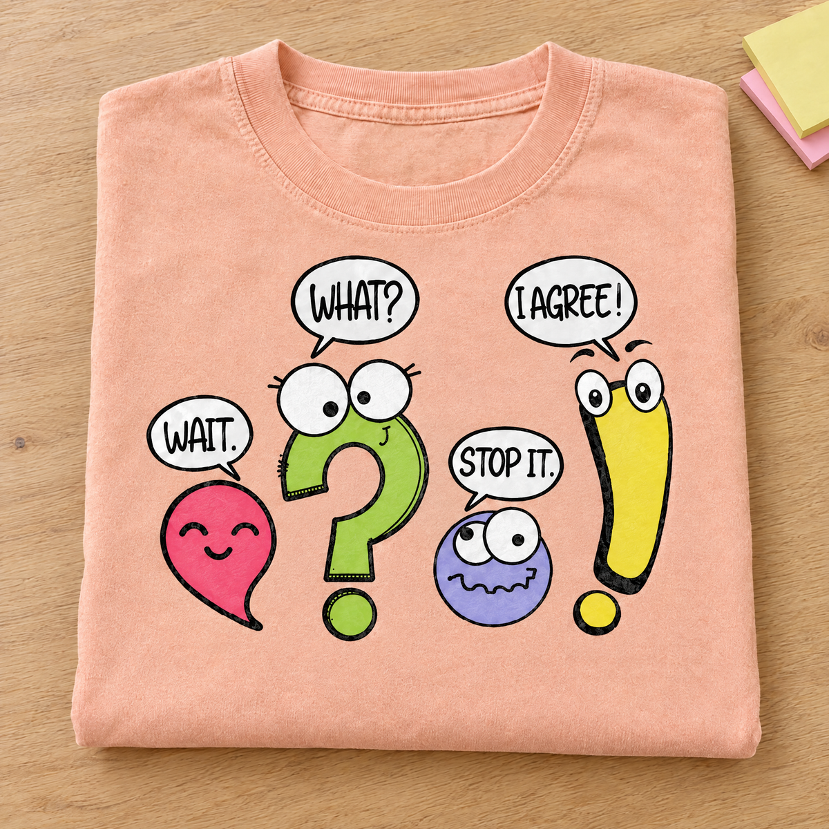 Punctuation shirt in Peachy Comfort Colors, neatly folded