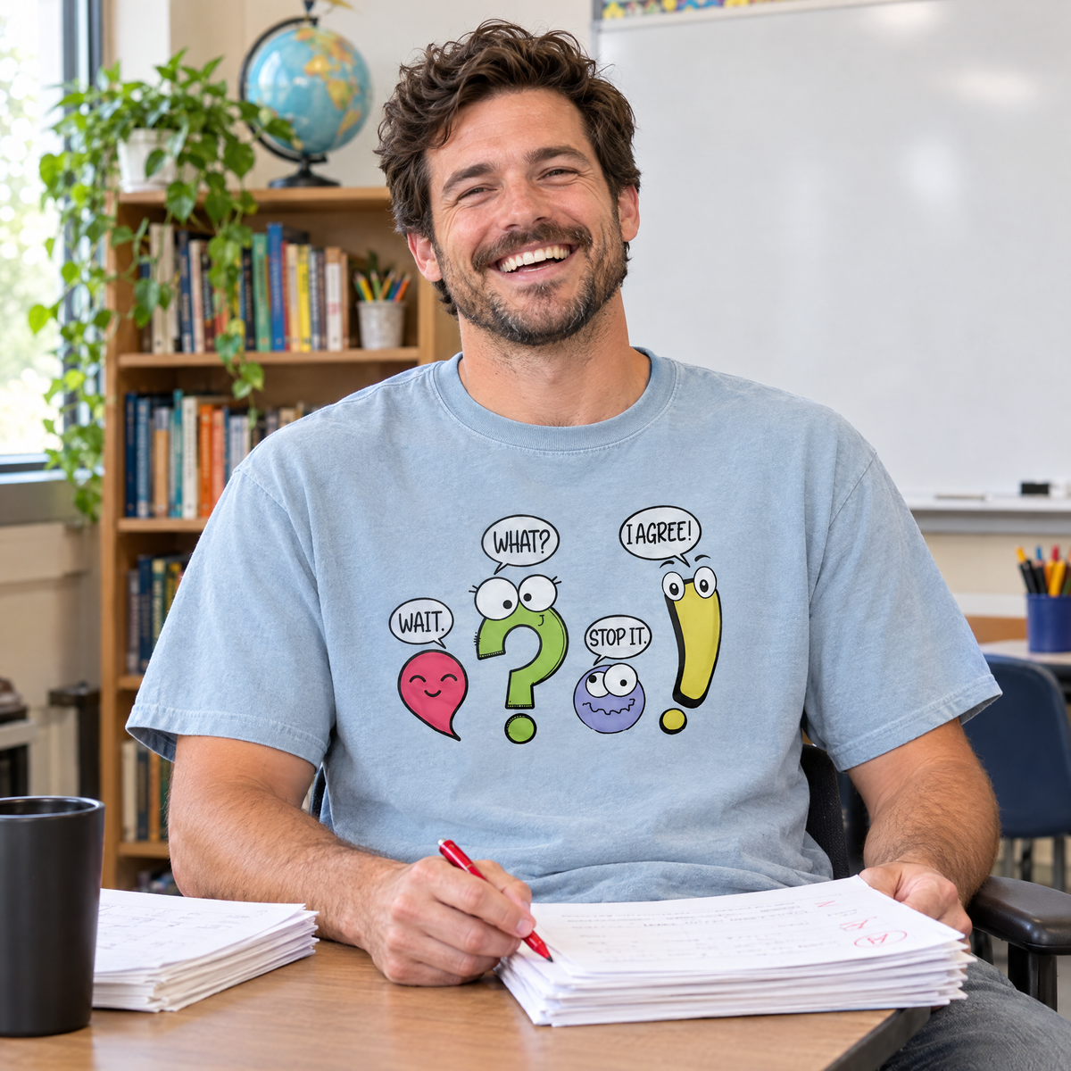 Punctuation shirt in Chambray Comfort Colors, worn by a seated model