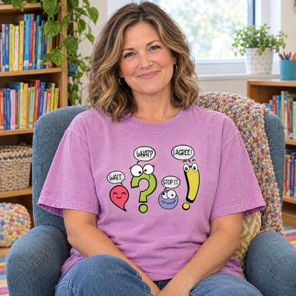 Punctuation shirt in Orchid Comfort Colors, worn by a seated model