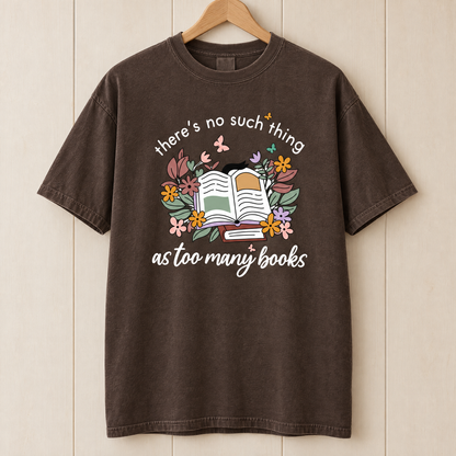 Too Many Books shirt in Espresso Comfort Colors, on a wooden hanger