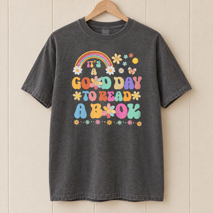 Good Day To Read A Book shirt in Pepper Comfort Colors, on a wooden hanger