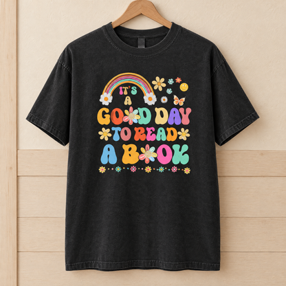 Good Day To Read A Book shirt in Black Comfort Colors, on a wooden hanger