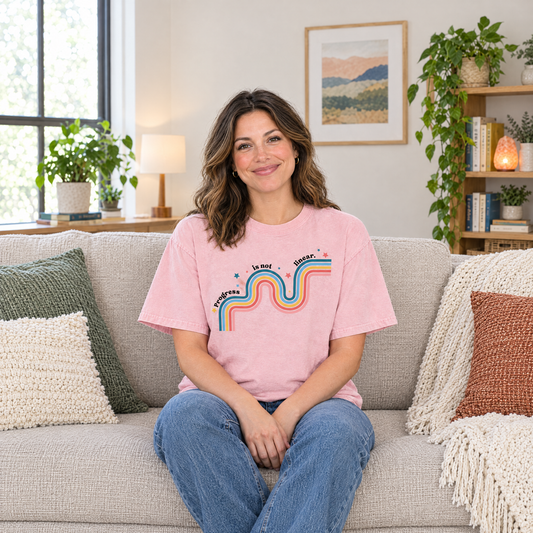 Progress Is Not Linear shirt in Blossom Comfort Colors, worn by a seated model