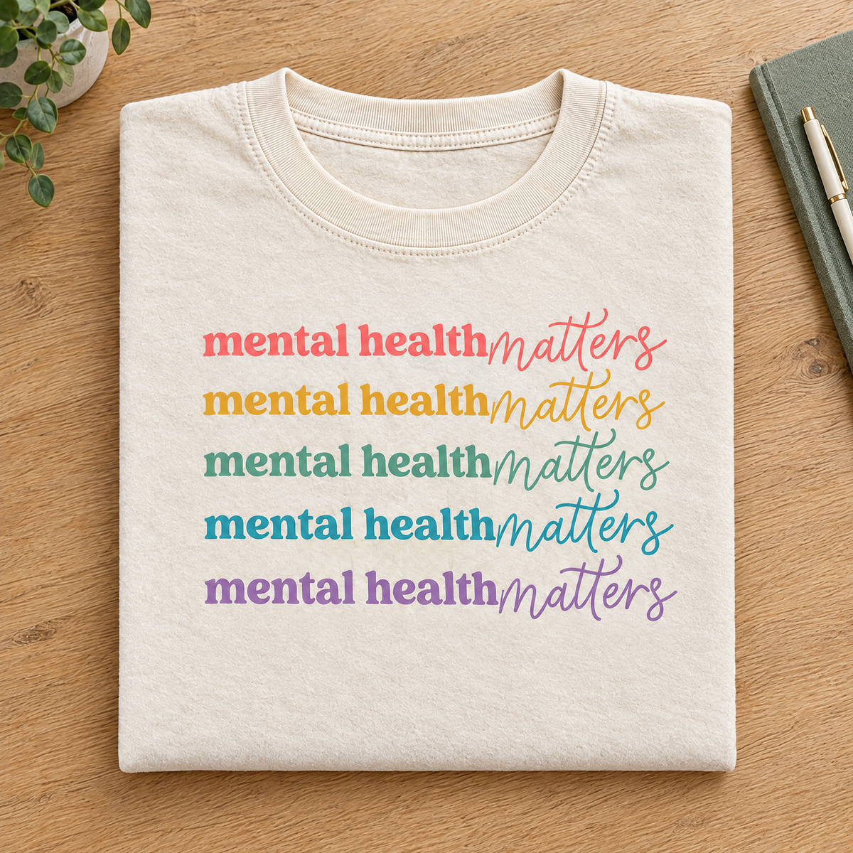 Mental Health Matters rainbow shirt in Natural/Ivory Comfort Colors neatly folded