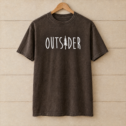 Outsider camping shirt with pine tree in Espresso Comfort Colors on a wooden hanger