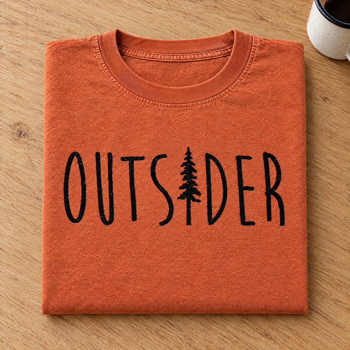 Outsider camping shirt with pine tree in Burnt Orange Comfort Colors neatly folded