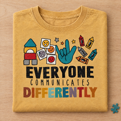 Everyone Communicates Differently autism acceptance shirt in Mustard Comfort Colors neatly folded