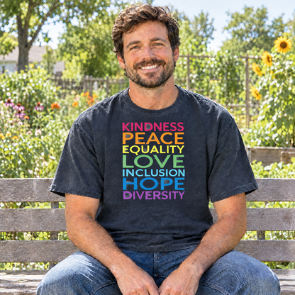 Kindness Peace Equality Love rainbow words shirt in Midnight Comfort Colors, man sitting on a bench in a community garden