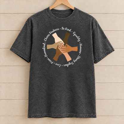 Choose Kindness diverse hands circle shirt in Pepper Comfort Colors on a wooden hanger