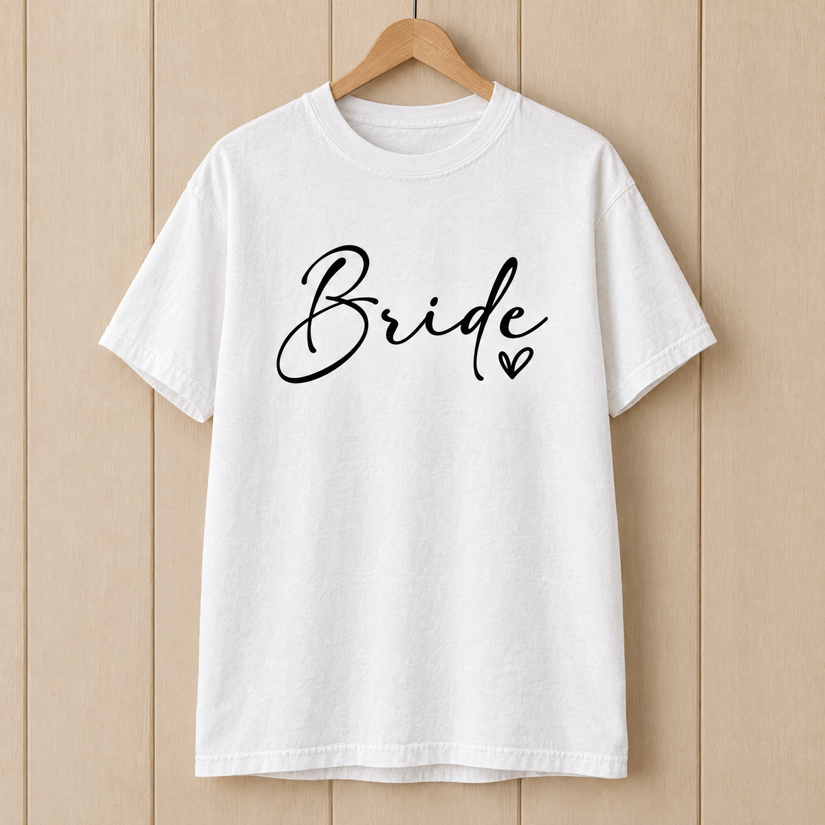Bride shirt in White Comfort Colors on a wooden hanger
