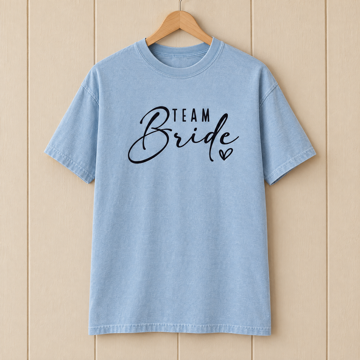 Team Bride shirt in Chambray Comfort Colors on a wooden hanger